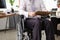 Employee man working in an office on wheelchair