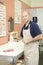 Employee Sharpening Knife At Meat Counter