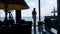 Employee silhouette watching tranquil sea office. Unknown businesswoman break