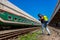 An employee sprays disinfectant on a outside of train as a precaution against a new coronavirus at
