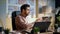 Employee talking video call at office desk close up. Man conducting web chat.