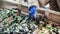 An employee at waste sorting plant