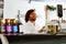 Employee weighing meat in butcher shop