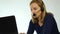 Employee working in a call center. Headset telemarketing woman talking on helpline. slow motion