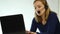 Employee working in a call center. Headset telemarketing woman talking on helpline. slow motion