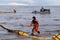 Employees of the environmental service clean up after low tide on the coast  Gulf of Finland remove garbage, oil spills, harmful