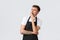 Employees, grocery stores and coffee shop concept. Bored or tired handsome cafe waiter in black apron, yawning and