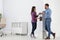 Employees having break near water cooler in office