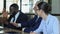 Employees laughing relaxing at business meeting, friendly atmosphere in office