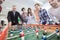 Employees playing table soccer