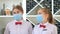 Employees of a restaurant in protective masks after quarantine. Interaction with restaurant manager and his staff on the