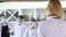 Employees of a restaurant in protective masks after quarantine. Interaction with restaurant manager and his staff on the
