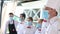 Employees of a restaurant in protective masks after quarantine. Interaction with restaurant manager and his staff on the