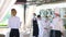 Employees of a restaurant in protective masks after quarantine. Interaction with restaurant manager and his staff on the