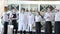 Employees of a restaurant in protective masks after quarantine. Interaction with restaurant manager and his staff on the