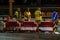 Employees of the road service in special yellow vests perform work on the repair of the roadway. Night road repairs in difficult