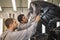 Employees of the shop painting the car body check the quality. production line