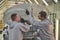 Employees of the shop painting the car body check the quality. production line