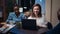 Employees sitting at boardroom table in business meeting