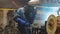 Employees welding automotive part