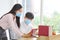 Employees working from home office while wearing medical face mask for social distancing in new normal situation after coronavirus