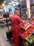 Employer sorting fresh vegetables at supermarket