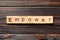 Empower word written on wood block. empower text on table, concept