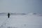 Empowered woman hiking in a frozen lanscape