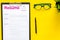 Empoyment concept with resume on yellow work desk background with pen, glasses top view