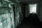 Empty abandoned bunker interior with glowing end