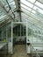 Empty abandoned vintage glass greenhouse