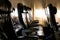 Empty airplane seats in the cabin in sunset light