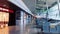 Empty airport interior during coronavirus pandemic, passengers wearing face masks, health and travel
