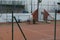 Empty all weather tennis court with umpires chair