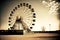 empty amusement park and large round ferris wheel