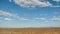 Empty arid meadow with mountains in the distance