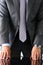 Empty arms of man in suit and tie closeup