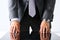 Empty arms of man in suit and tie closeup