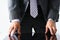 Empty arms of man in suit and tie closeup