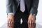 Empty arms of man in suit and tie closeup