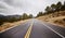 Empty asphalt road, color toning applied, Colorado, USA