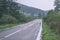 empty asphalt road in the countryside in autumn - vintage matte