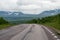 Empty asphalt road in the middle of the mountains in the wild Abisko, Sweden