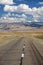 Empty Asphalt road in Mongolia with mongolian town Bayan-Olgii