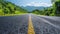 empty asphalt road with mountains.