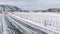 Empty asphalt road in Norwegian countryside in winter. Lofoten islands, Norway.