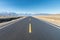 Empty asphalt road to distant landscape