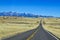 Empty asphalt road toward the mountains