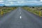 Empty asphalt road into wild nature of Iceland in summer