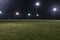 Empty athletic soccer fields at night with lights on